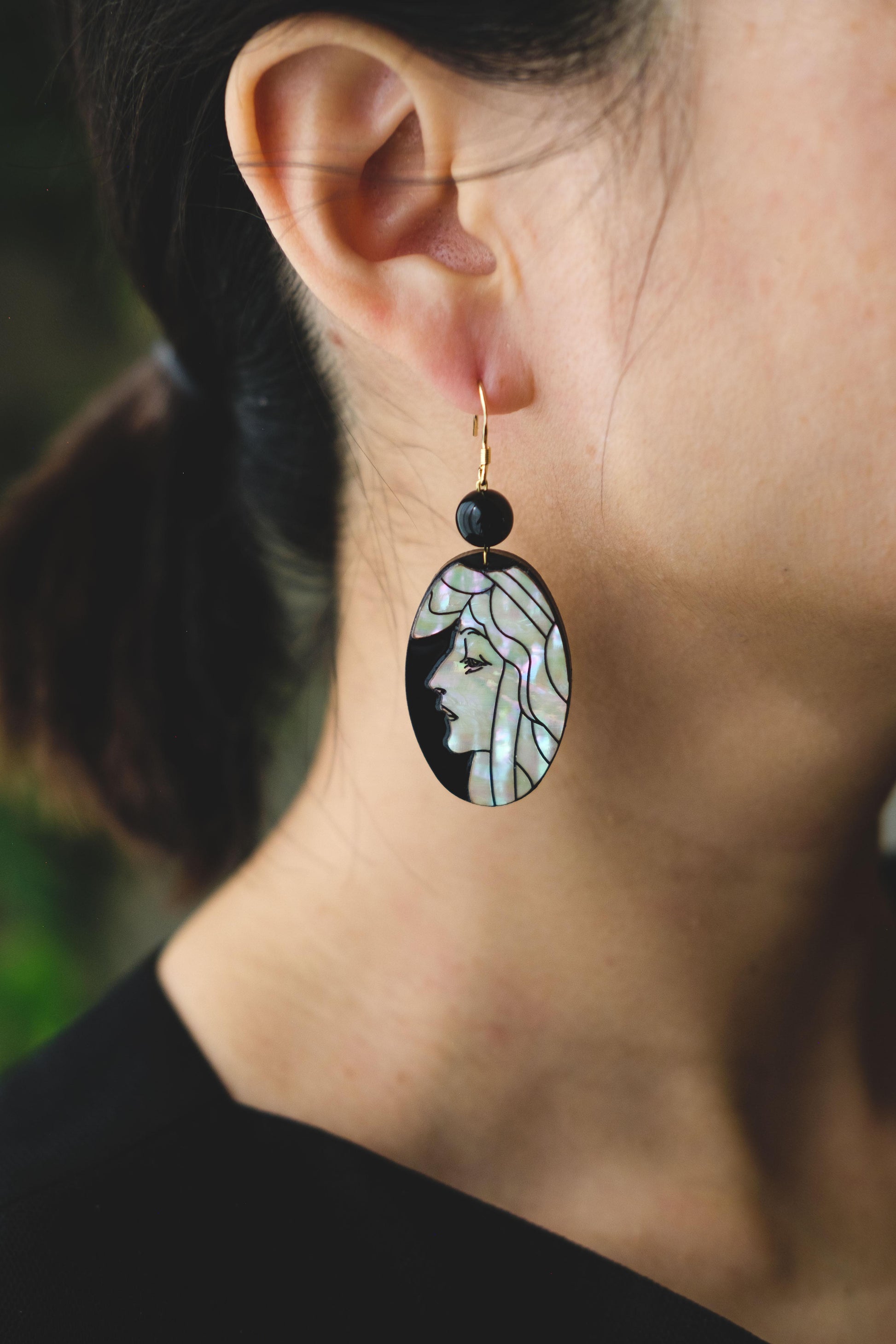 Mother of pearl earrings with engraved portrait of women in art nouveau style..