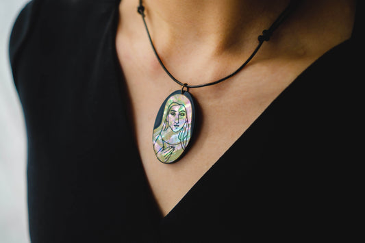 Mother of pearl necklace with engraved portrait of Virgin Mary.. 
